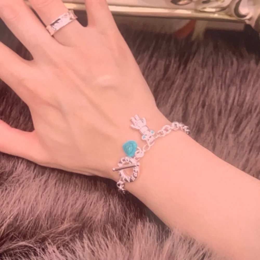 Tiffany & Co. Silver Charm Bracelet with Blue Heart and Bear
